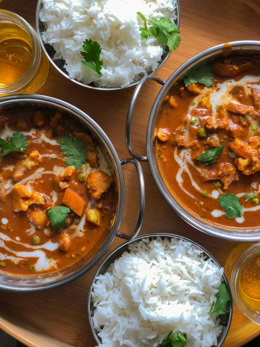 Curries and rice shared across the table